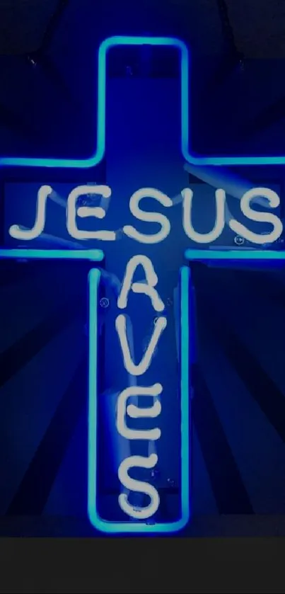Neon sign cross reading "Jesus Saves" in blue glow.